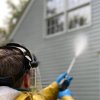 I live in Newton MA and my white siding looks greenish. Why is that?